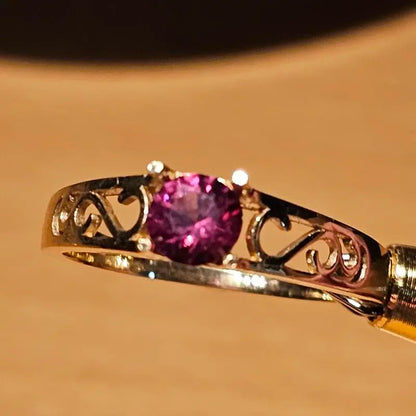 14ct Gold ring with facetted Umbalite Garnet