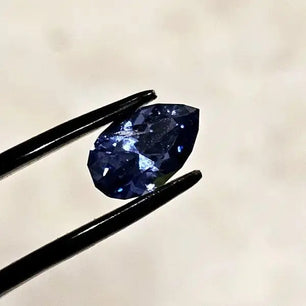 Sapphire Elegance: Facetted Blue Teardrop Scandinavian Gem Design