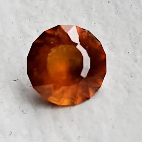 Hessonite Brilliance: 1.1ct Round Facetted Gem - Scandinavian Gem Design