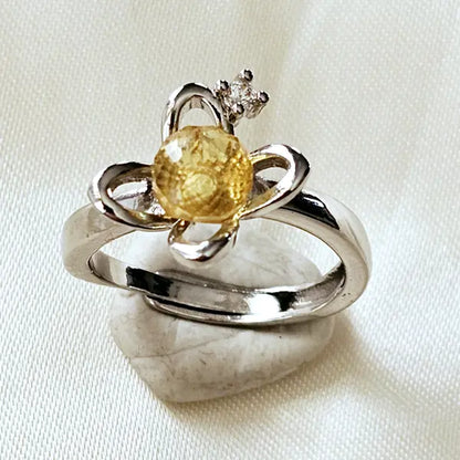 Silver plated ring with facetted yellow Amber