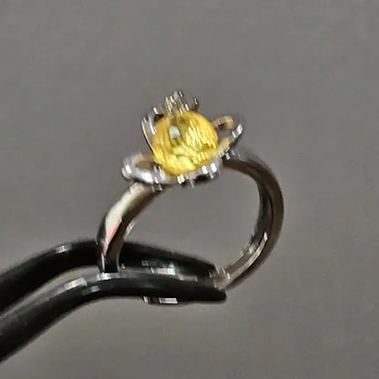 Silver plated ring with facetted yellow Amber